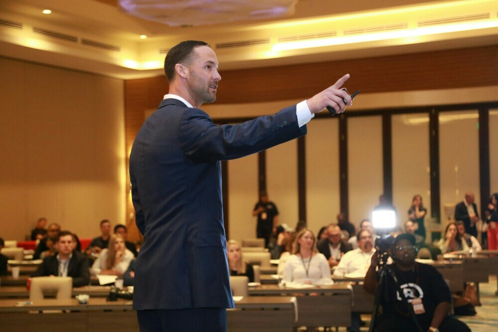 Image of a witness testifying in a court room.