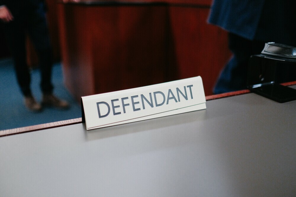 image showing defendant name tag in the court room.