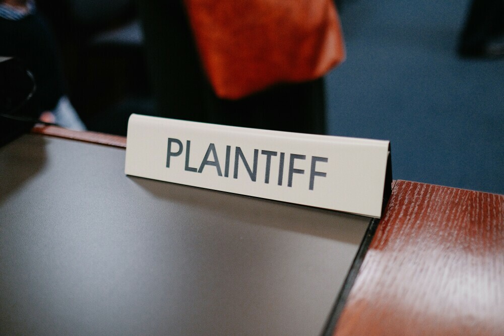 Image showing plaintiff  name tag in the courtroom.